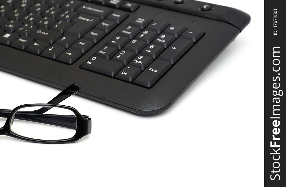 Glasses On Computer Keyboard