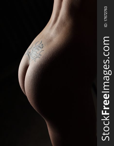 Woman Buttocks With Tattoo