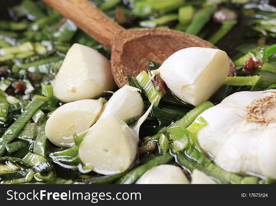 Stir frying spring onion and garlic