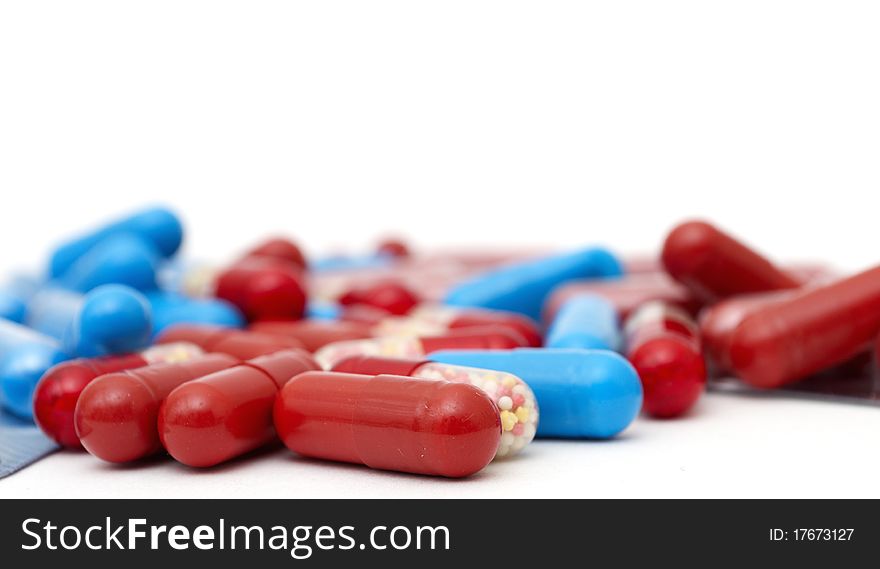 Macro of medical pills isolated on background. Macro of medical pills isolated on background