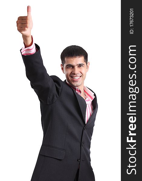 Happy young man in a business suit showing thumbs up and smiling on white background. Happy young man in a business suit showing thumbs up and smiling on white background