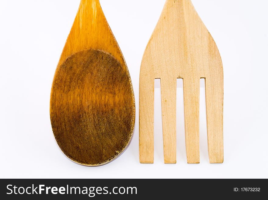 Kitchenware wooden spoon and fork with white background