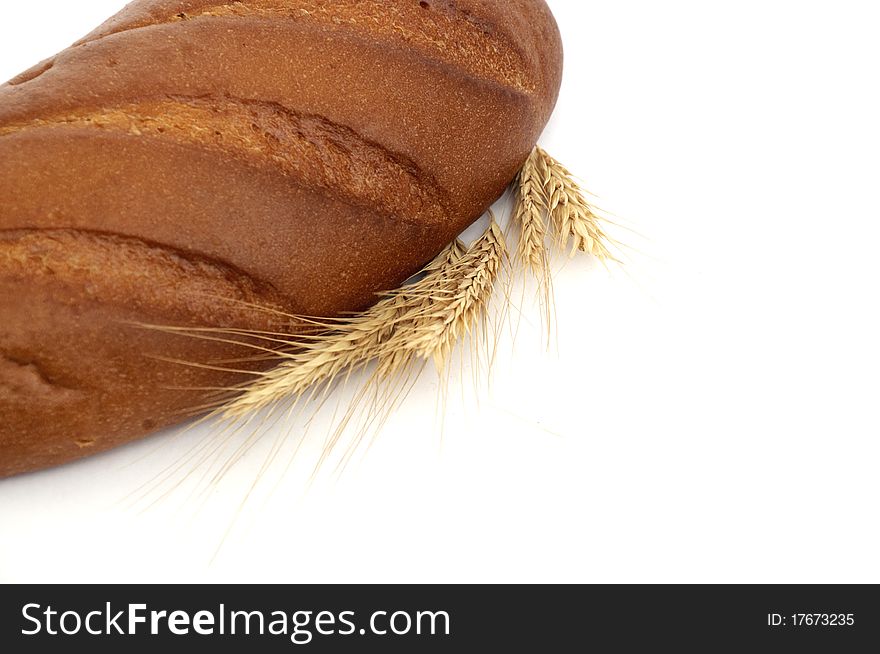 Wheat And Bread Over White Background