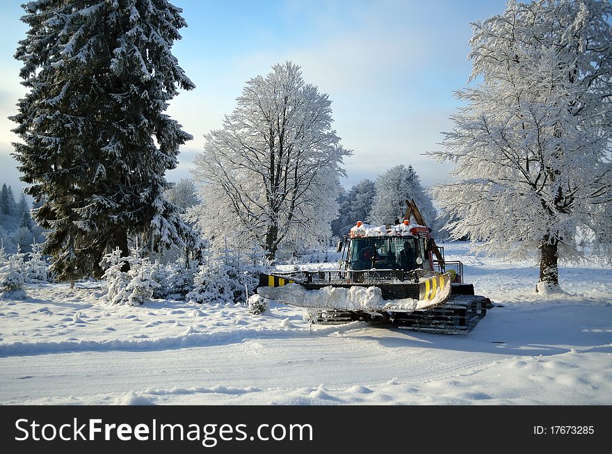 Ski machine (snow cat) grooming cross-country piste before competition. Ski machine (snow cat) grooming cross-country piste before competition