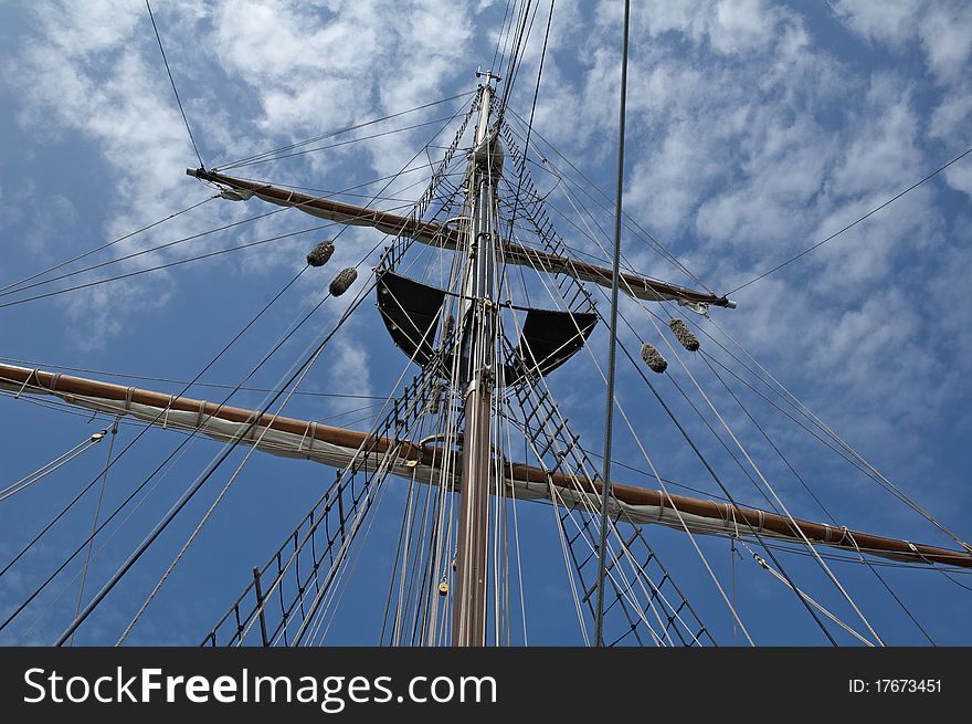 This mast was reaching for the beautiful cloudy sky. This mast was reaching for the beautiful cloudy sky.