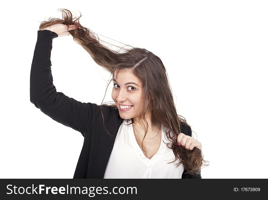 A beautiful woman pulling her long hair. A beautiful woman pulling her long hair