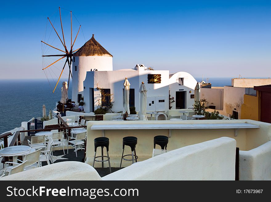 The hotel view with windmill on Santorini. The hotel view with windmill on Santorini