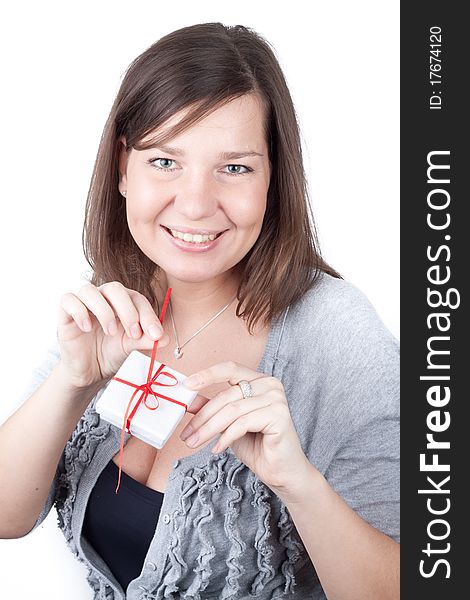 Portrait of a charming young girl on a white background holding valentine gift. Portrait of a charming young girl on a white background holding valentine gift