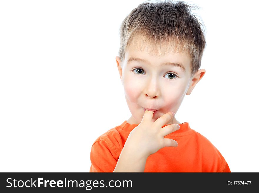 Portrait of a funny little boy making faces. Isolated over white background.