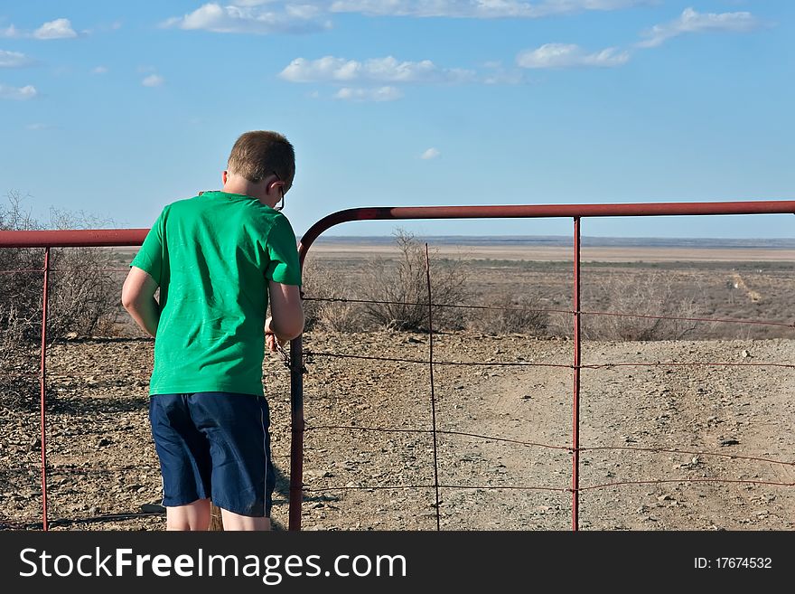 Boy Opening Farm Gate