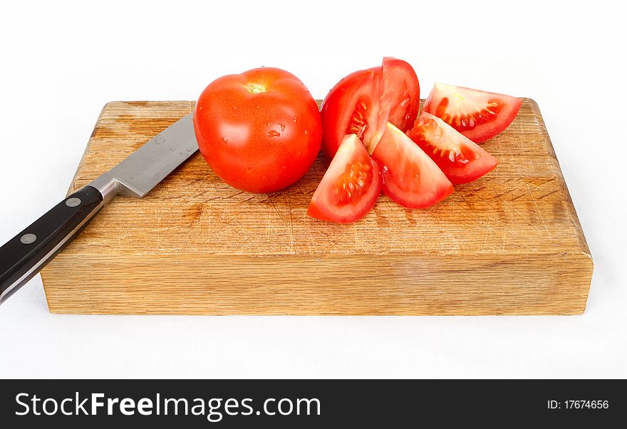 Sliced tomatoes on a cutting board. Sliced tomatoes on a cutting board