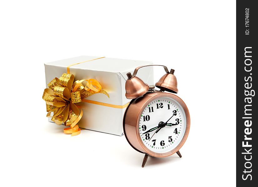 A retro clock with presents isolated on white bacground