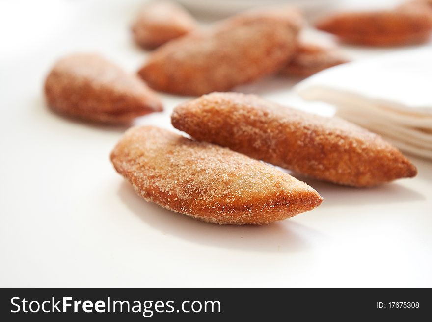 An abundance of Sweet fried cherry turnovers on white. An abundance of Sweet fried cherry turnovers on white