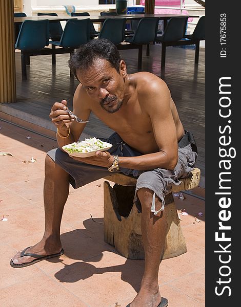 Thai man eats