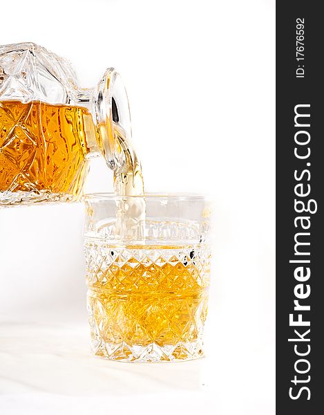 Frozen bottle of whisky with on white background