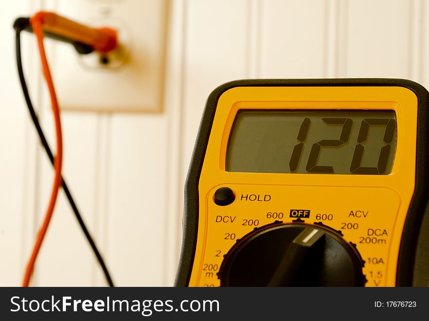 Volt meter reading voltage of wall outlet. Volt meter reading voltage of wall outlet.