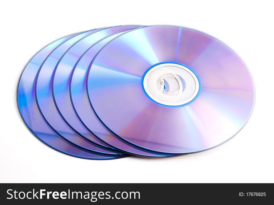 Five compact discs on a white background