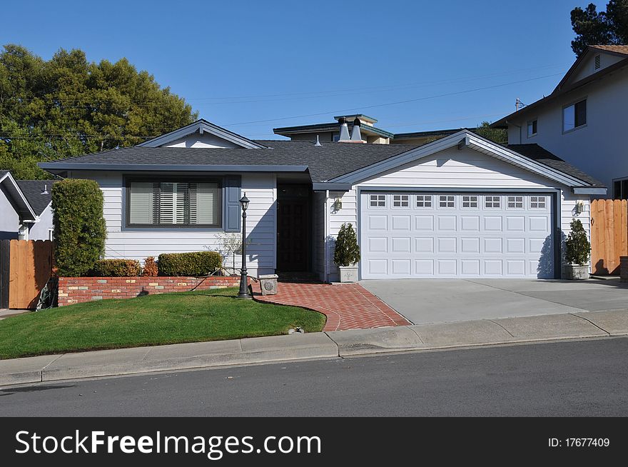 House Surrounded By Trees And Grass