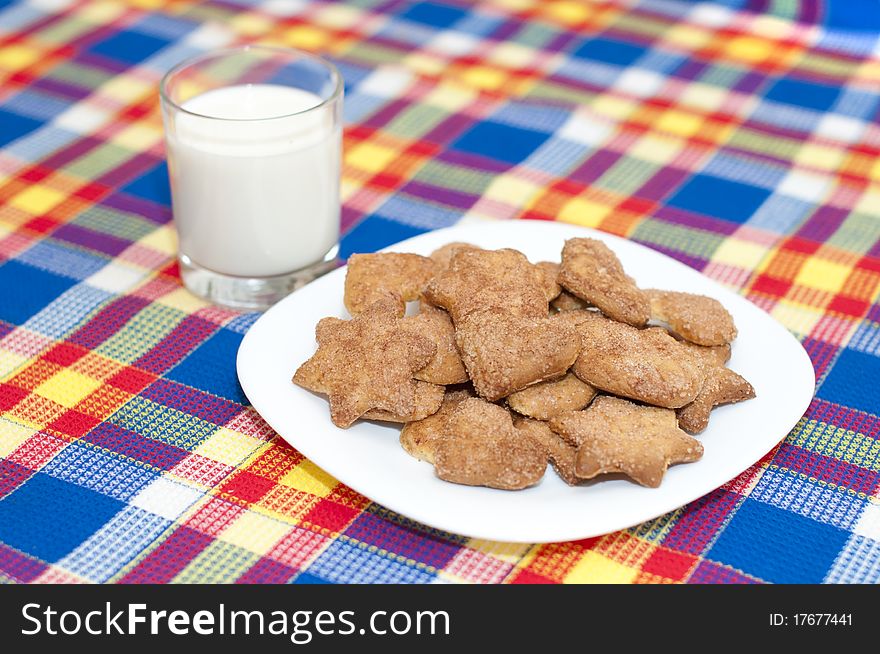 Heap of cookies with a glass of milk. Heap of cookies with a glass of milk