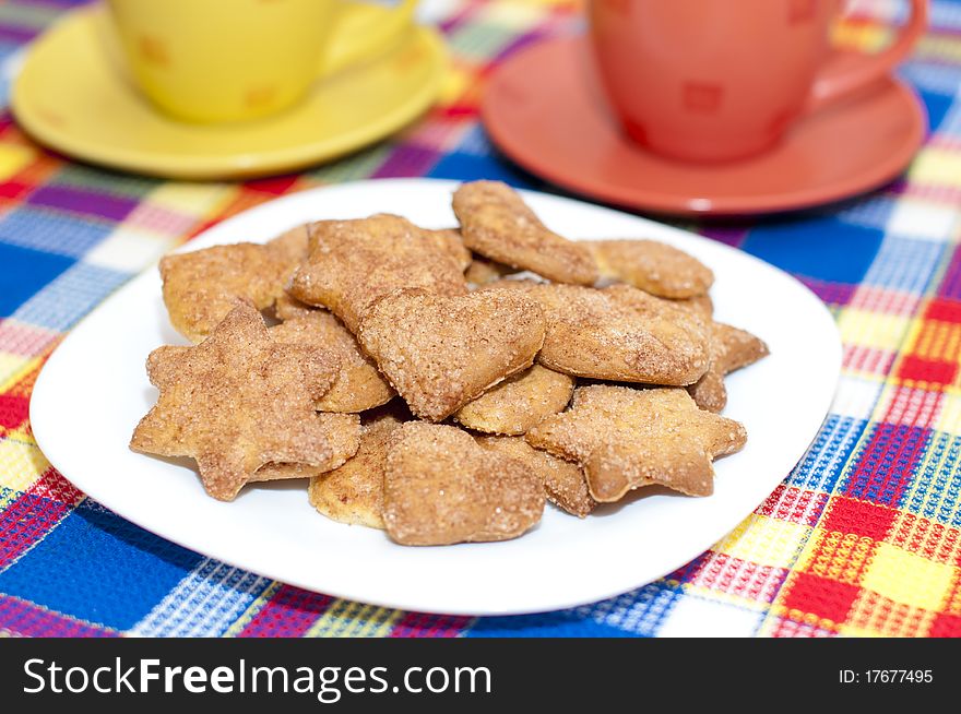 Cookies on a plate with two cups. Cookies on a plate with two cups