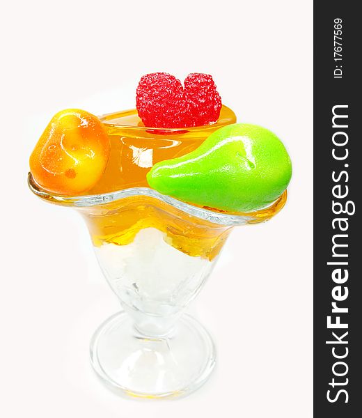 Orange dessert with pudding and jelly fruits