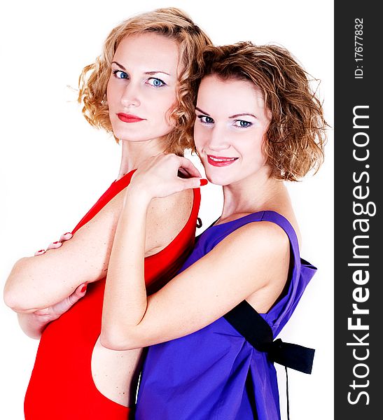 Beauty sisters in bright dress isolated on a white