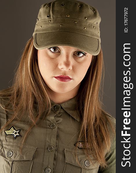 Beautiful woman in military urban clothes