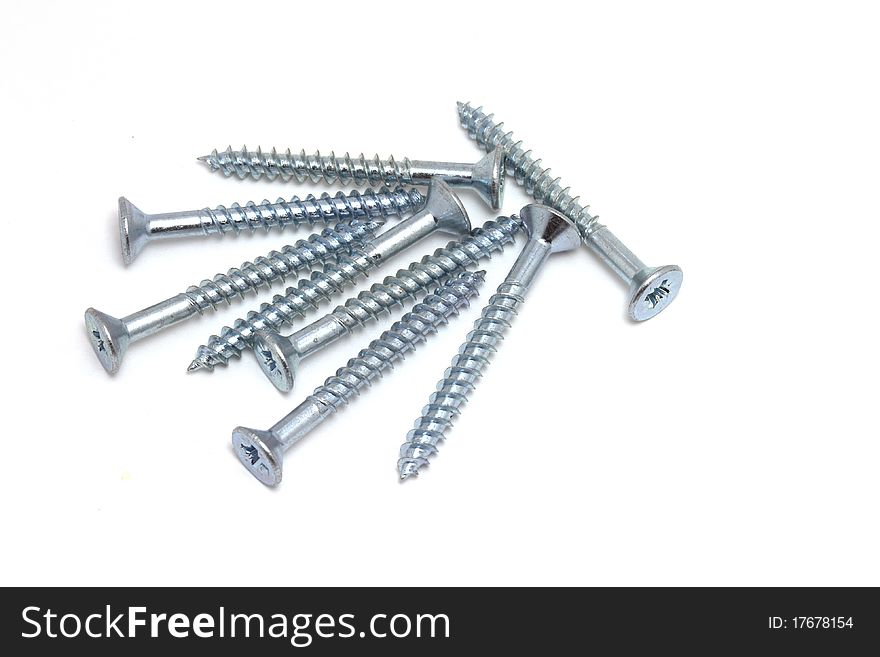 Several silver steel wood screws. Several silver steel wood screws