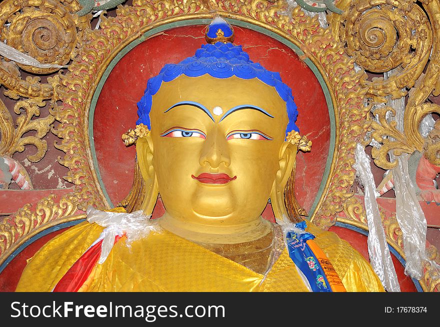 Closeup view of golden buddha statue in Tibet
