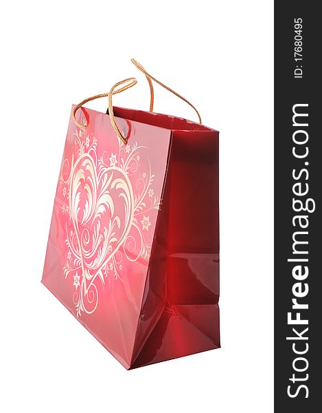 Gift paper bag with heart isolated on white. Clipping path included.