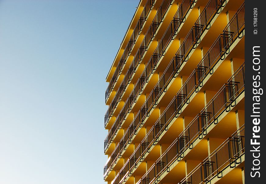 The photography of block of flats on the blue sky.