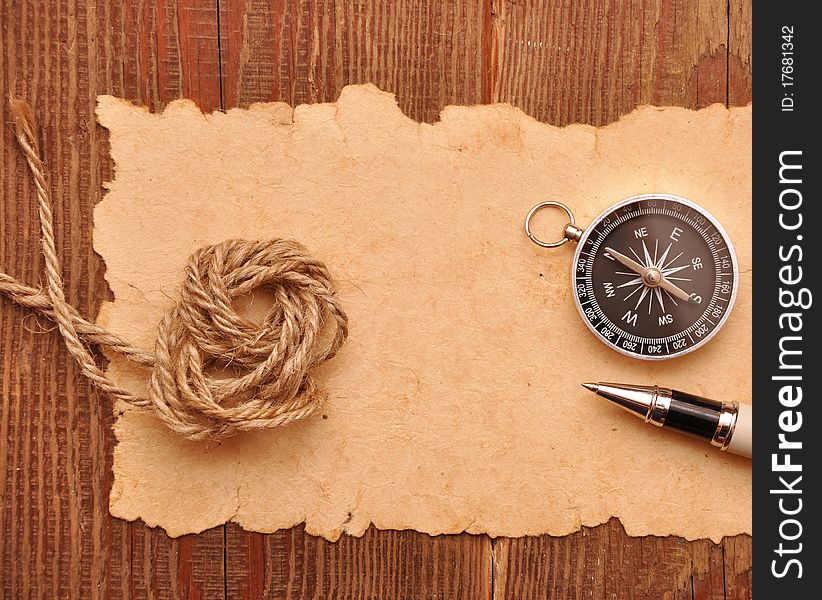 Compass And Rope On Grunge Background