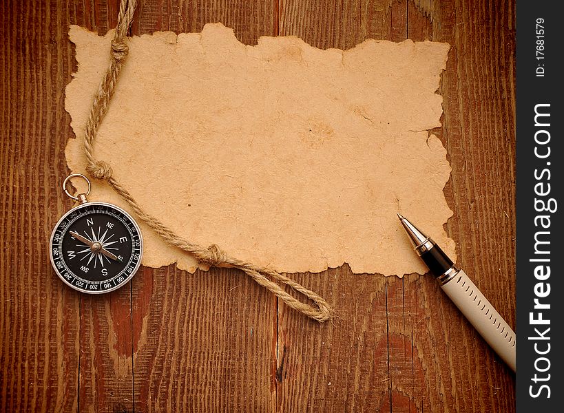 Compass, pen and rope on grunge background. Compass, pen and rope on grunge background