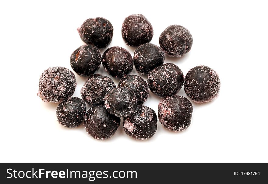 Frozen black currant on white background