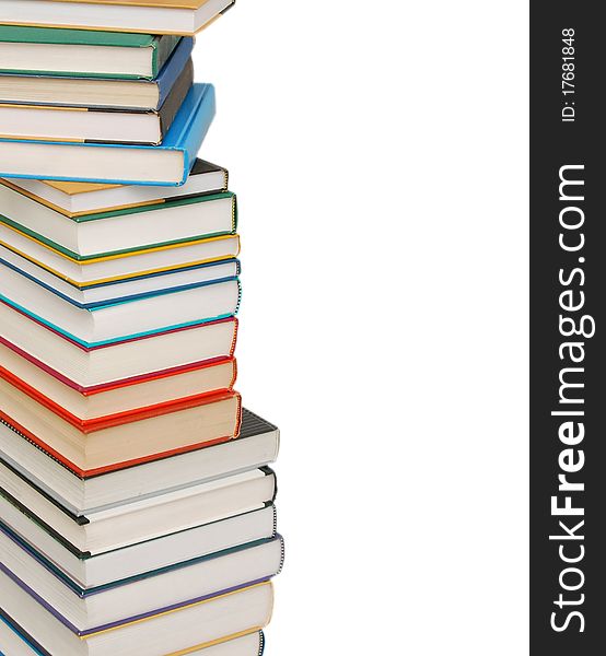 Stack of colorful real books on white background, partial view. Stack of colorful real books on white background, partial view.