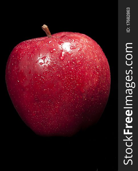 Fresh red apple with black background