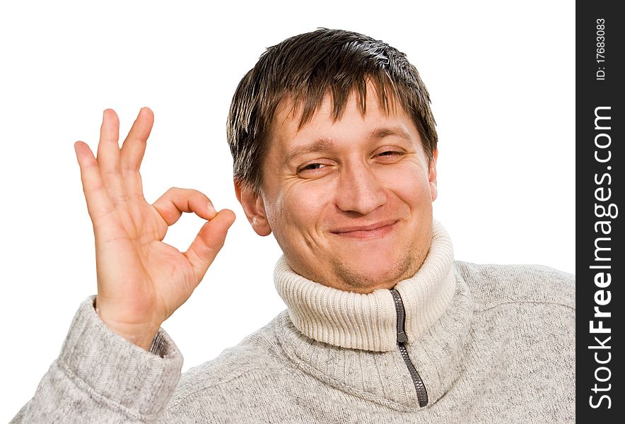 A young man shows a hand gesture (sign) OK. A young man shows a hand gesture (sign) OK.