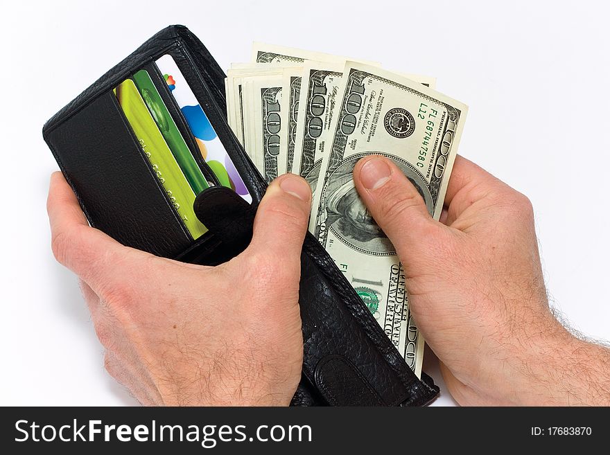 A man takes dollars out of the bag in white background