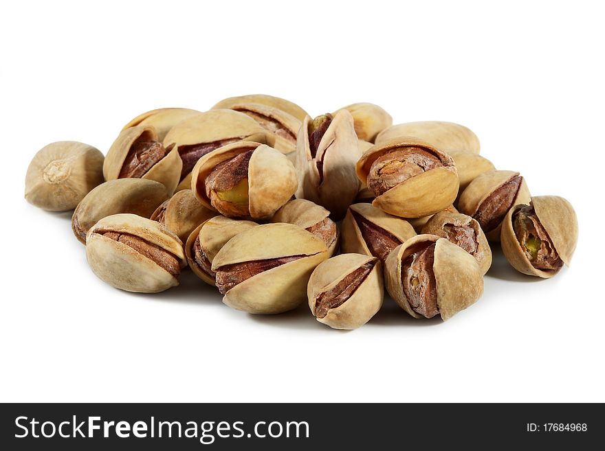 Pistachio nuts and salt isolated on white background