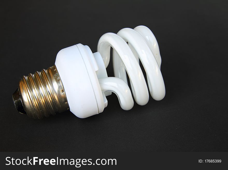 A florescent bulb symbolizing the saving energy of and money. A florescent bulb symbolizing the saving energy of and money