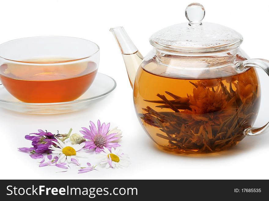 Teapot With Floral Brewed Tea And Flowers