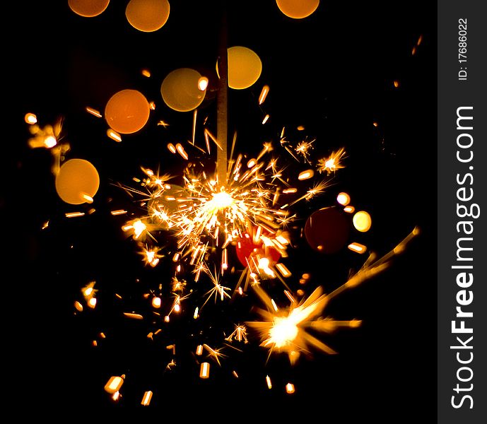 Golden fire works sparkle with black background. Golden fire works sparkle with black background