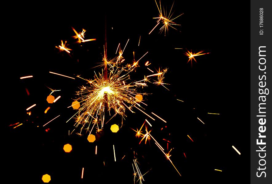 Golden fire works sparkle with black background. Golden fire works sparkle with black background