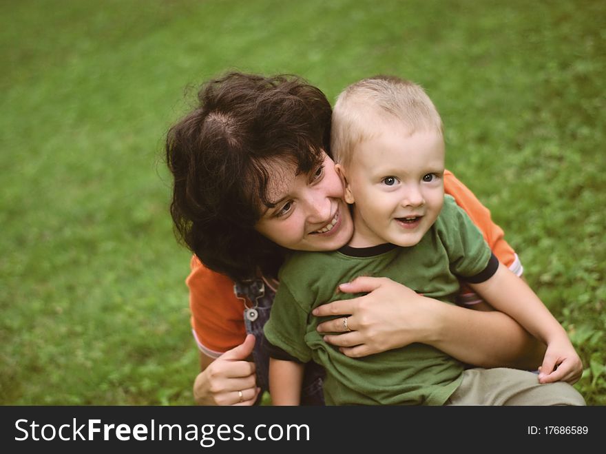 A little boy and his mother in the park