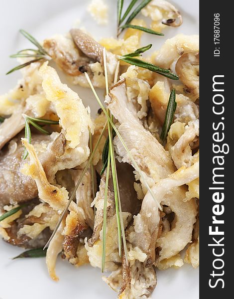 Fried oyster mushrooms prepared with rosemary