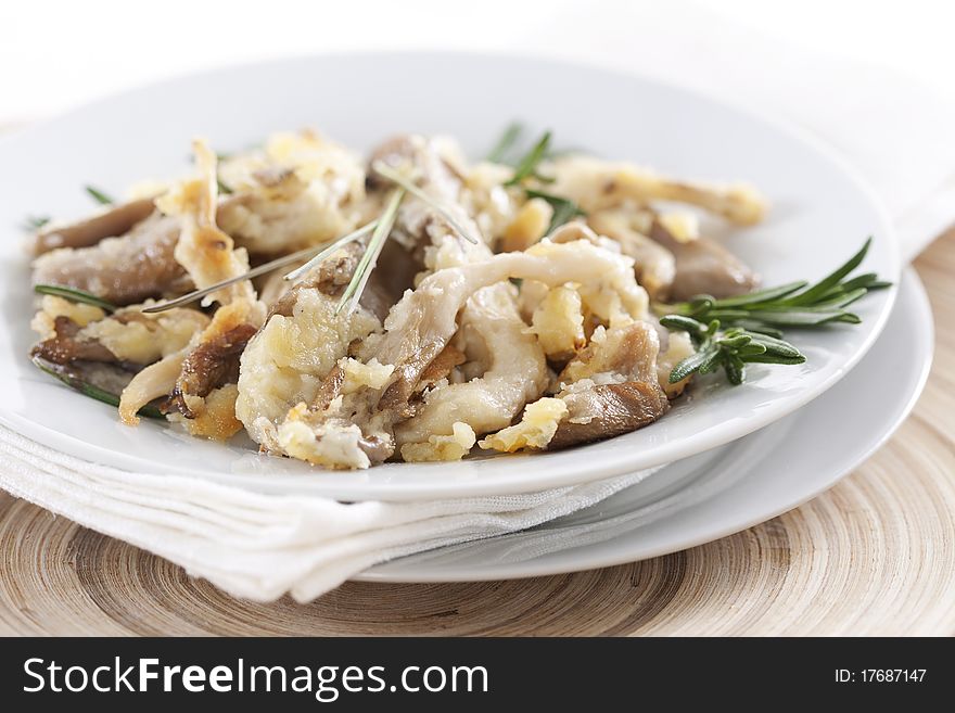 Fried oyster mushrooms prepared with rosemary