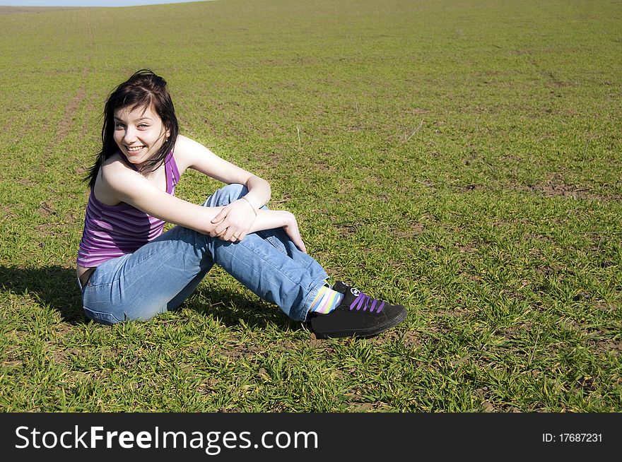 Beautiful Black Hair Girl on green field