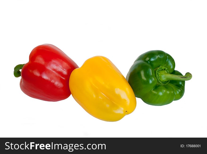 Red,yellow and green pepper in isolated on white. Red,yellow and green pepper in isolated on white