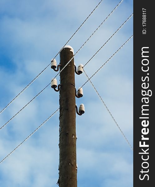 Electric pole with wires on a background of blue sky. Electric pole with wires on a background of blue sky.