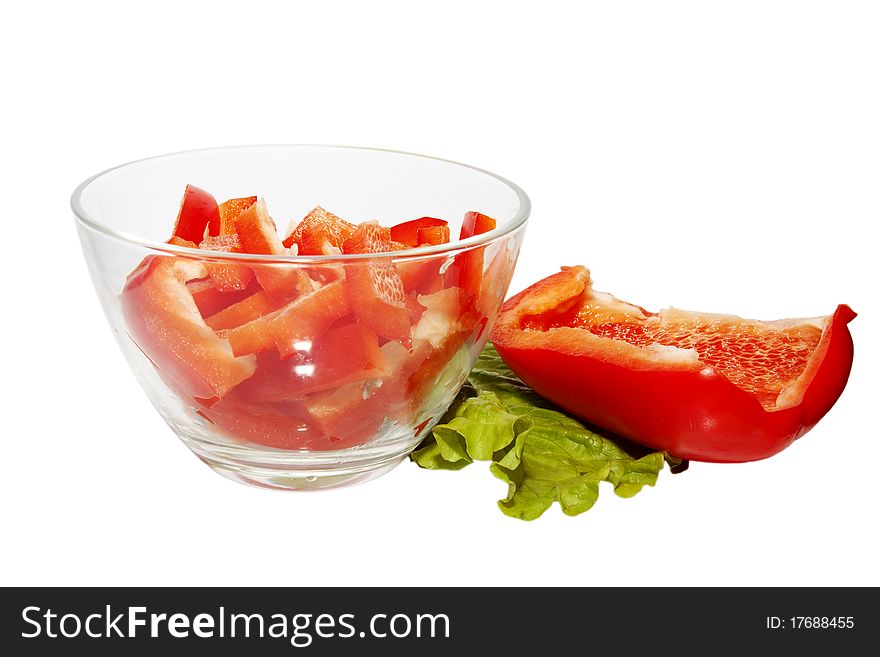 Sweet red pepper, chopped pieces in a glass bowl. Sweet red pepper, chopped pieces in a glass bowl